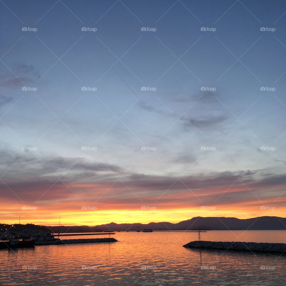 Sunset over Corfu Town old harbour, Greece