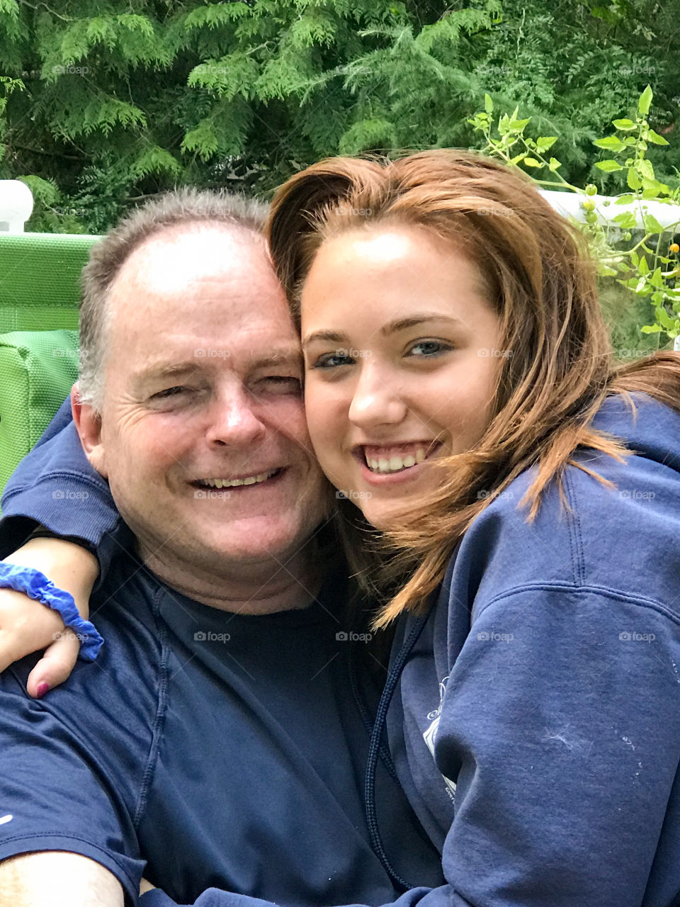 My fav moments are primarily times with my family. Some of my favourite moments involve my husband and his four girls. Here he is hugging our eldest daughter while we’re enjoying the beautiful weather on our deck with our family. 