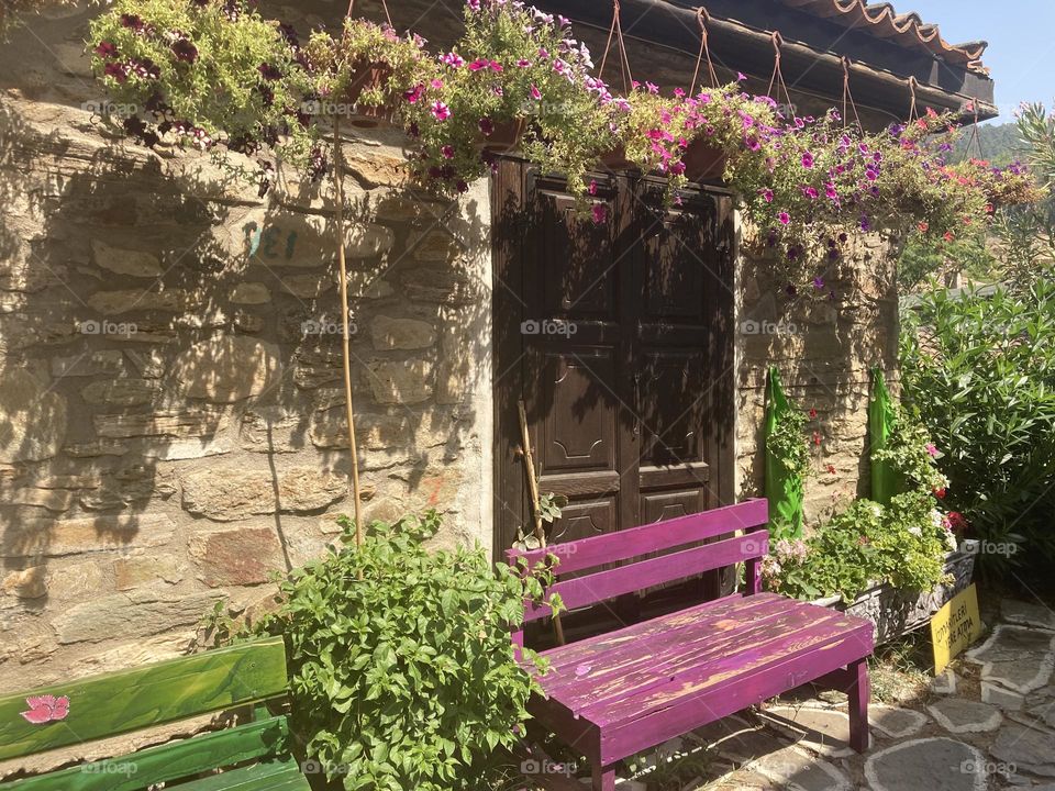 Greek village in Turkey. Blue sky and tall palm trees. Sunsets and sunny days. Summertime in Kusadasi. Vacation travel in Turkey . Summer view. Sunny day during vacation. Hidden gems and secret places.