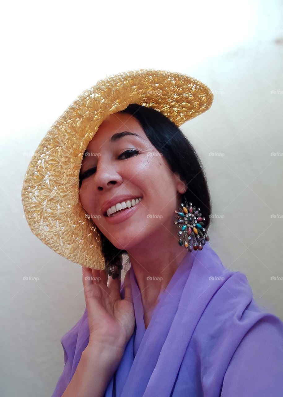 Portrait of Beautiful Smiling Woman with Yellow Hat