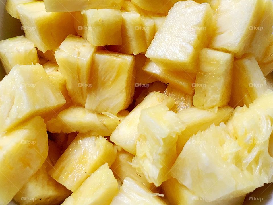 Cubed sliced pineapple fruit closeup 