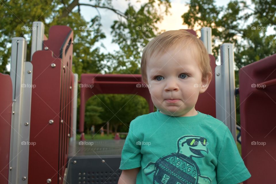 Cute toddler at playground candid
