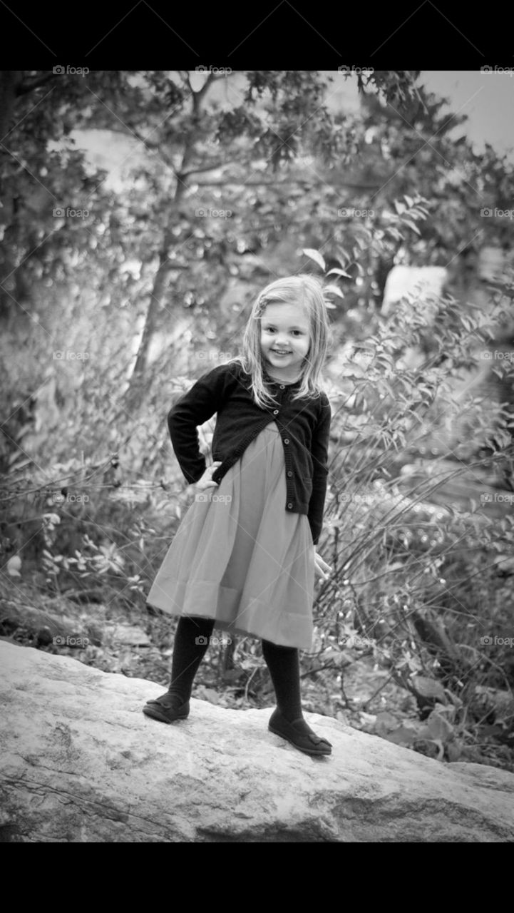 Little Girl Modeling on a Rock