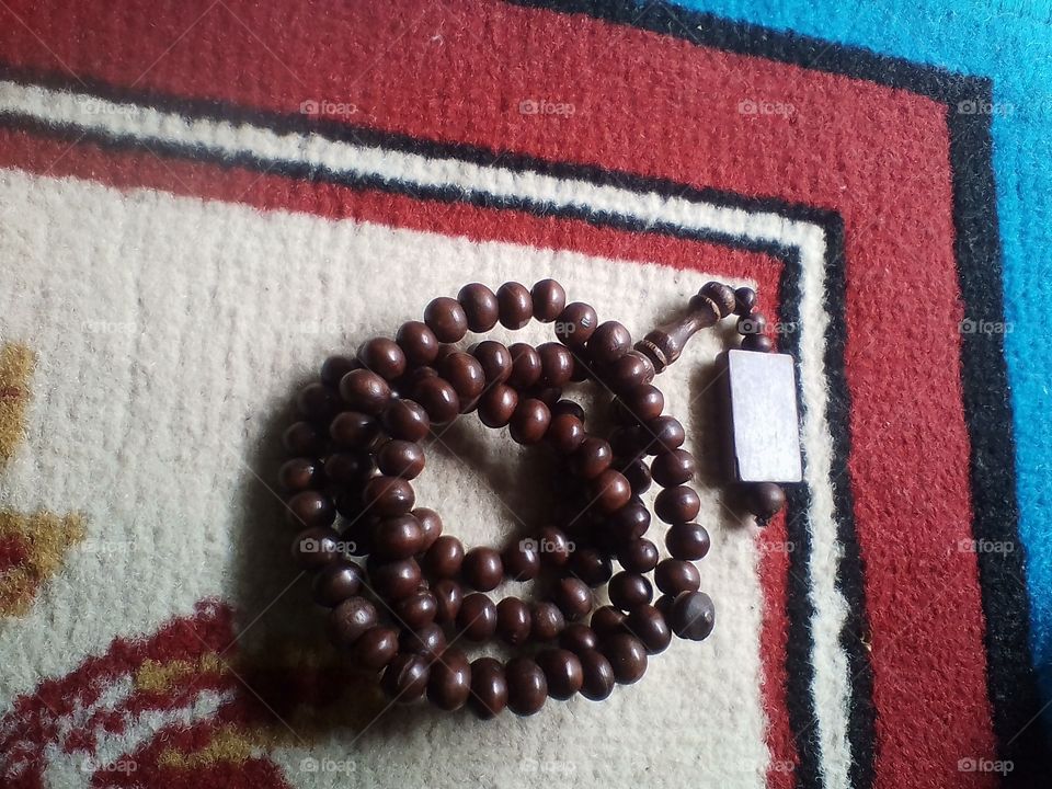This is a wooden prayer beads that Muslims use to recite Allah