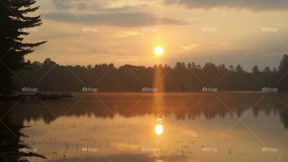 reflection of the rising sun