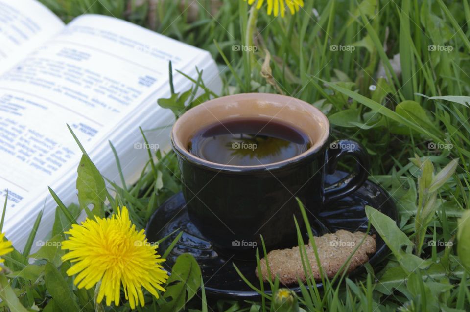 open book and cup of coffee