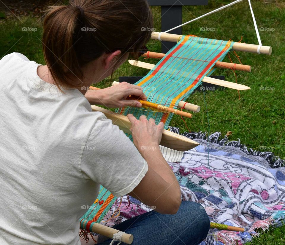 Woman working on a hand loom