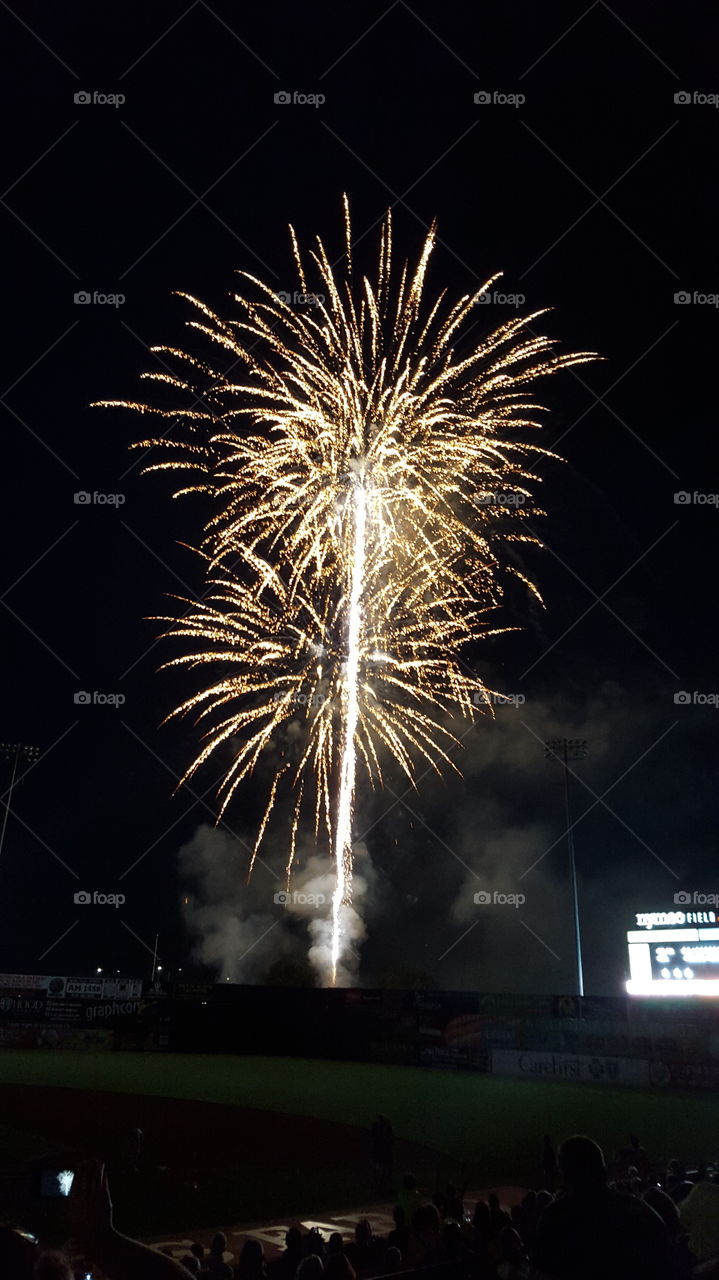 white fireworks. white hot fireworks light up the night sky after a Frederick Keys baseball game in historic Frederick,  Maryland