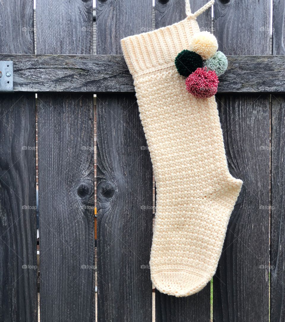 Handmade crocheted cream colored Christmas stocking with Pom Poms