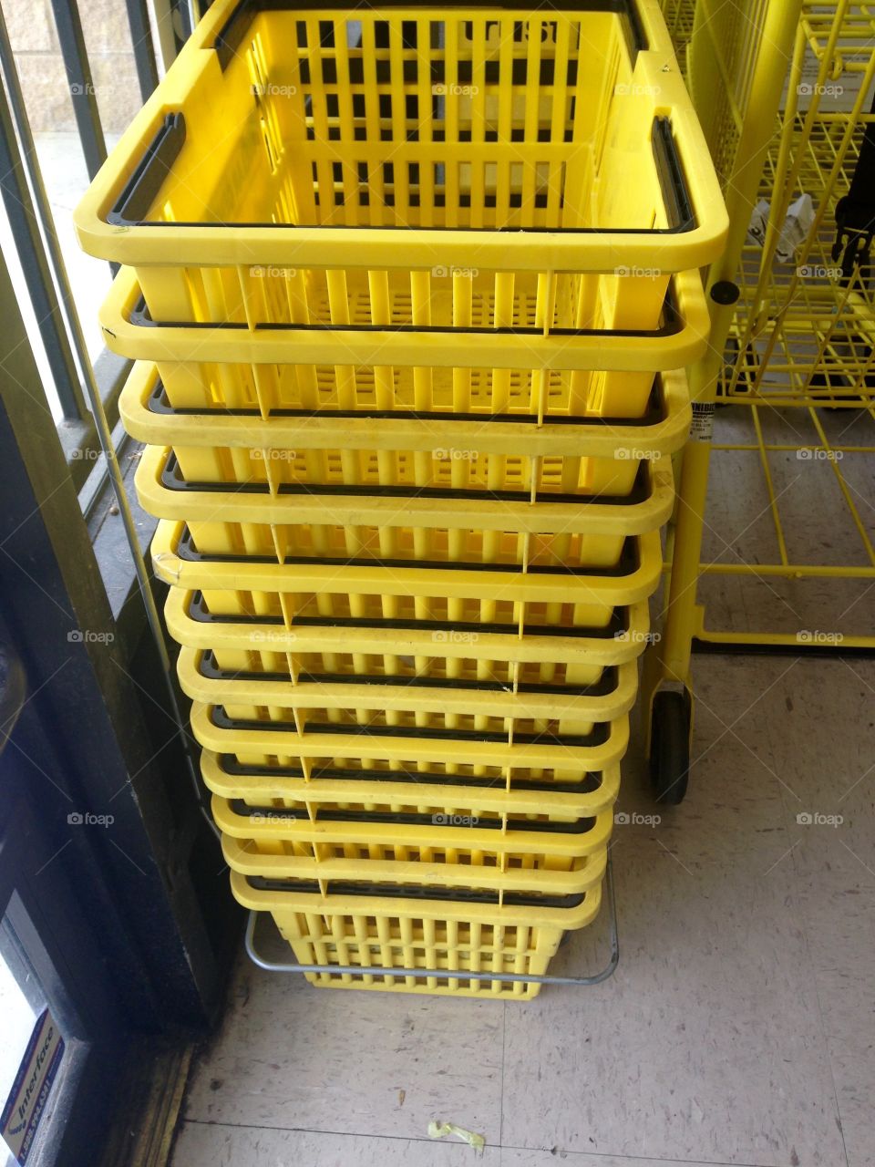 Yellow stacked shopping baskets 