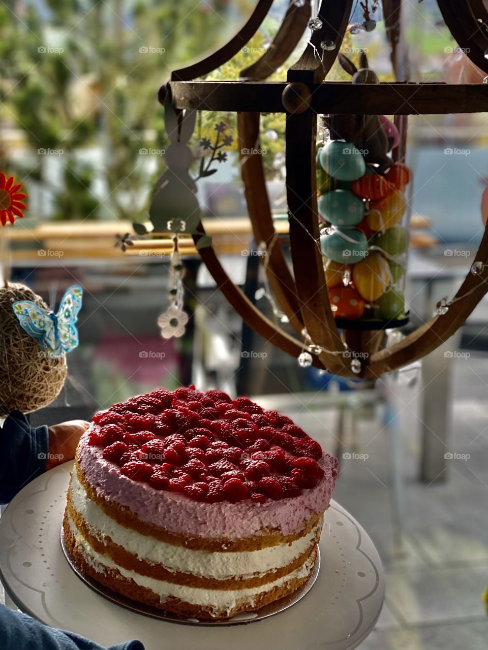 yellow Easter cake, birthday cake, bunny cake, chocolate bunnies, chocolate eggs, colored eggs, Easter eggs, colorful eggs, flowers on the cake, good Easter, raspberry cream cake