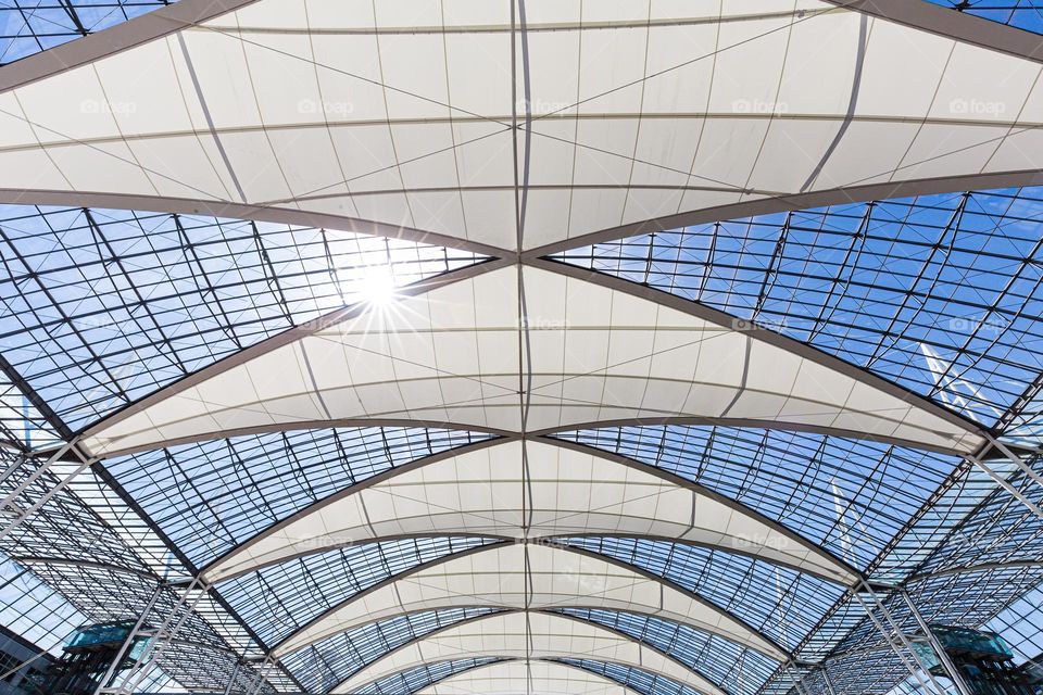Triangle shaped sun screen protection in the glass ceiling at Munich airport 