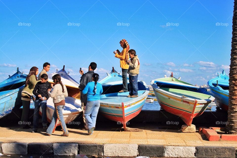 Egyptian kids playing on the boats