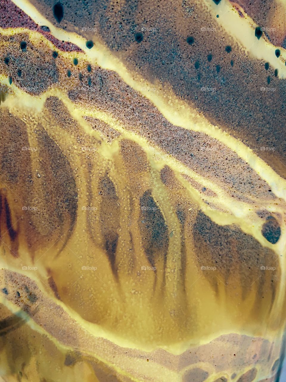 Neutral colored hand blown glass close up 