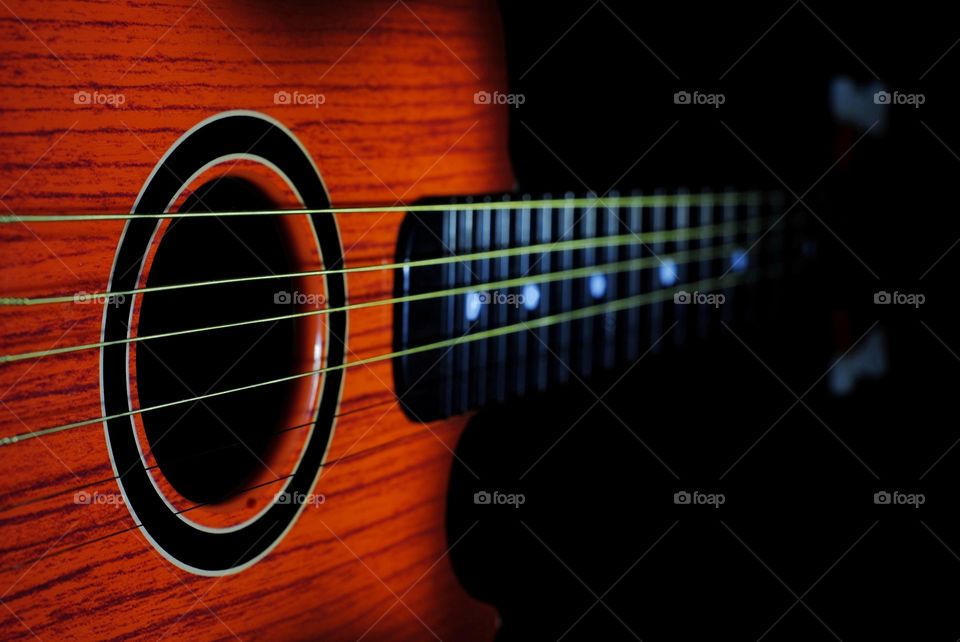 Classical guitar on a black background