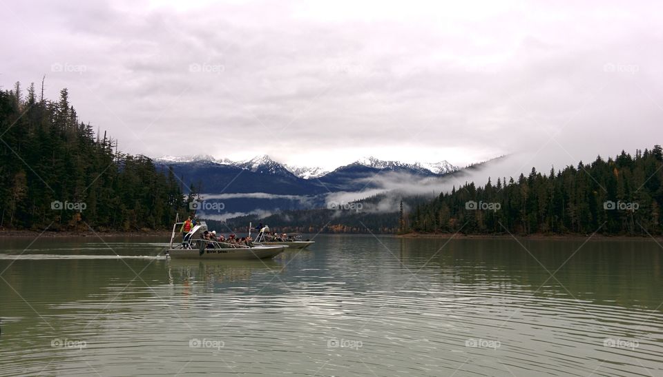 Boat on the lake. Boat on the lake, looking for bears in the forest - Rocky Mountains, Canada