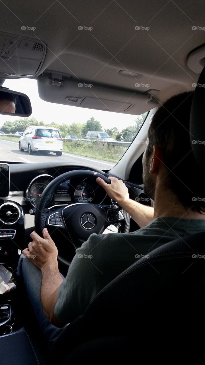 Driver in a car driving on the motorway 