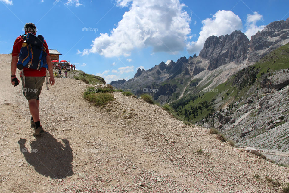 Rear view of a man hiking in the Dolomites