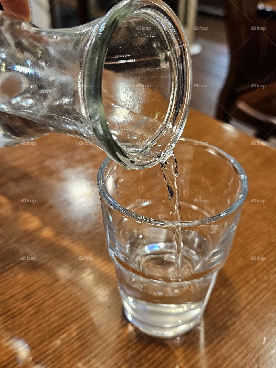 Pour water into the glass and the water column flows