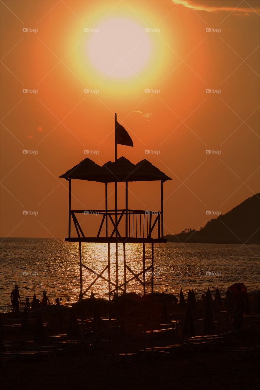 lifeguard tower in sunset