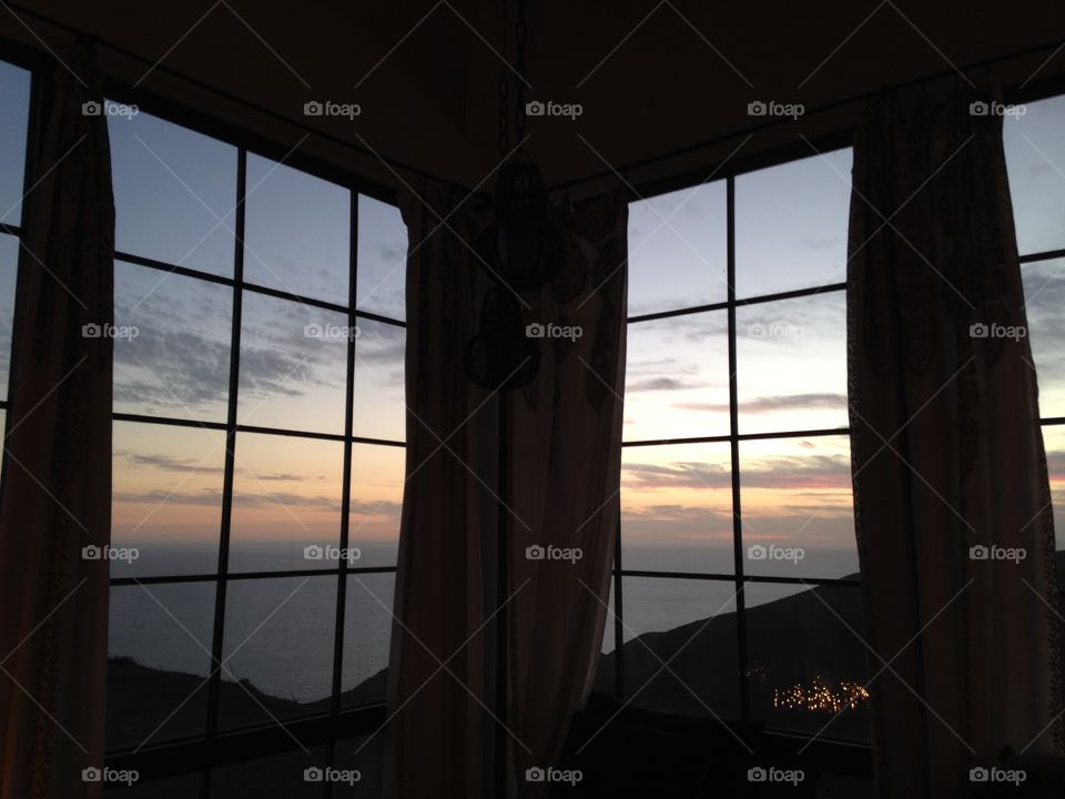 Sunset through windows. Sunset through two windows