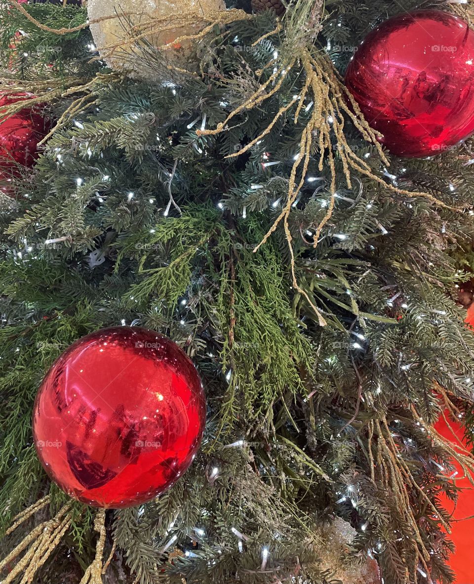 Red Christmas balls decor in a Christmas tree