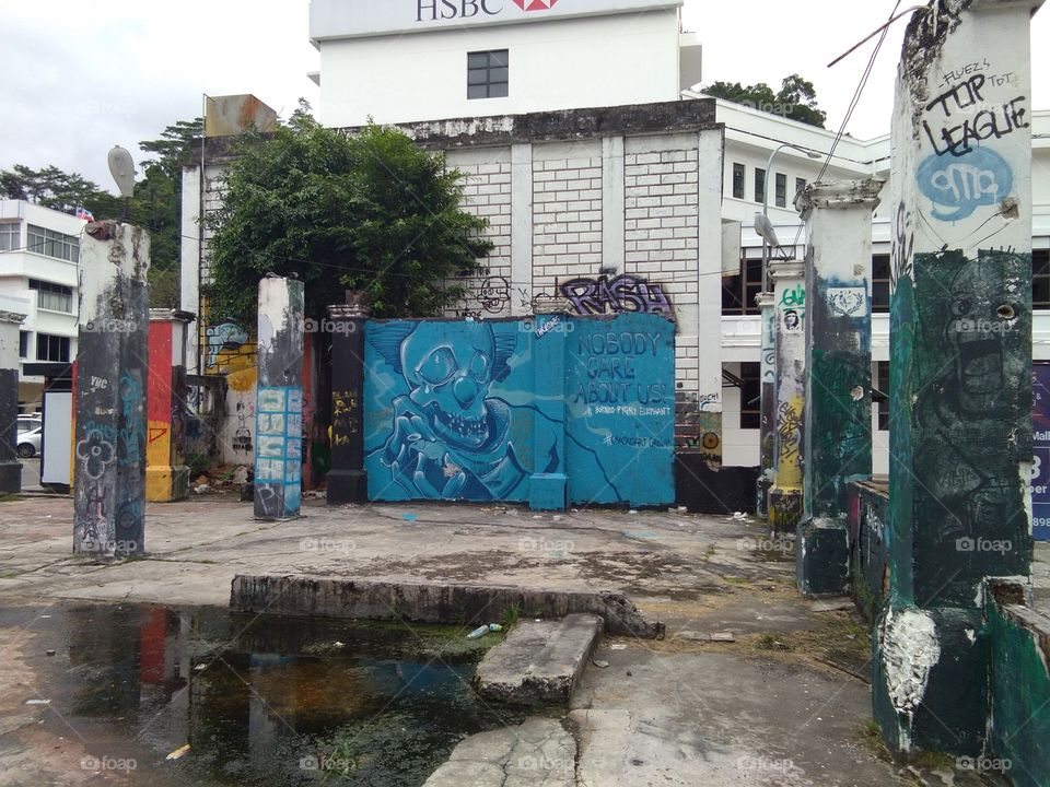 Graffiti are writing or drawings that have been scribbled, scratched, or painted illicitly on a wall or other surface, often within public view