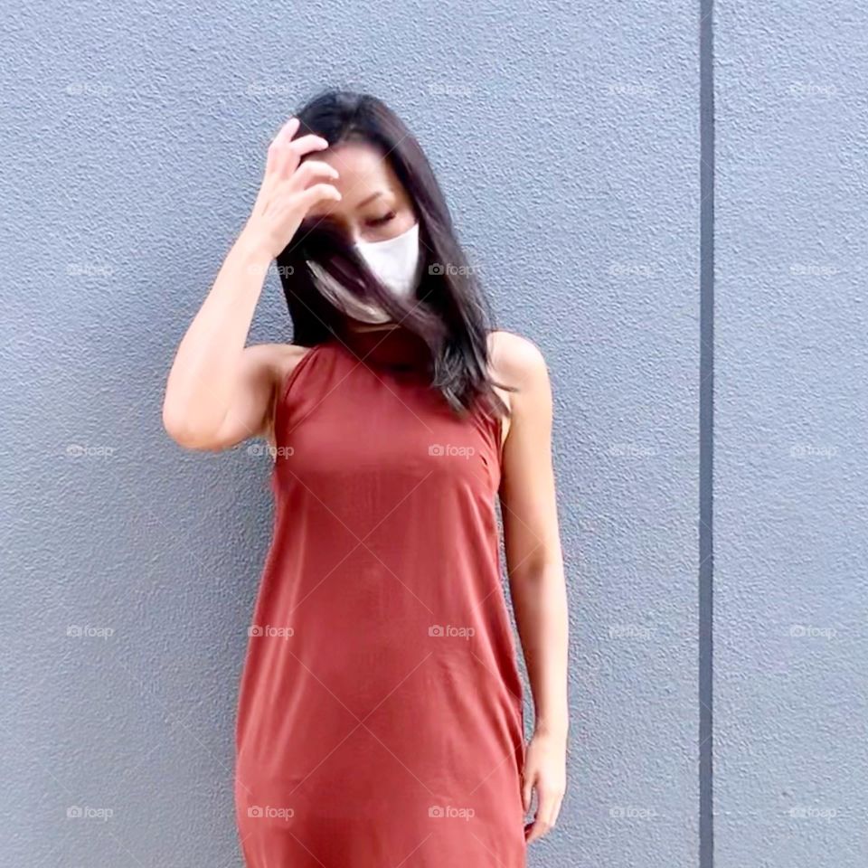 Asian woman in silver grey ash hair colour outdoor 