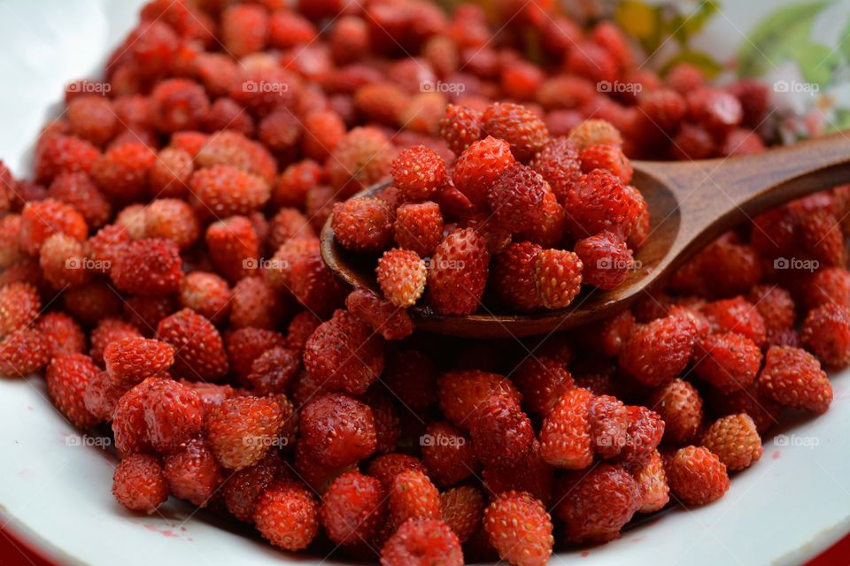 red strawberries on a plate tasty healthy summer food background