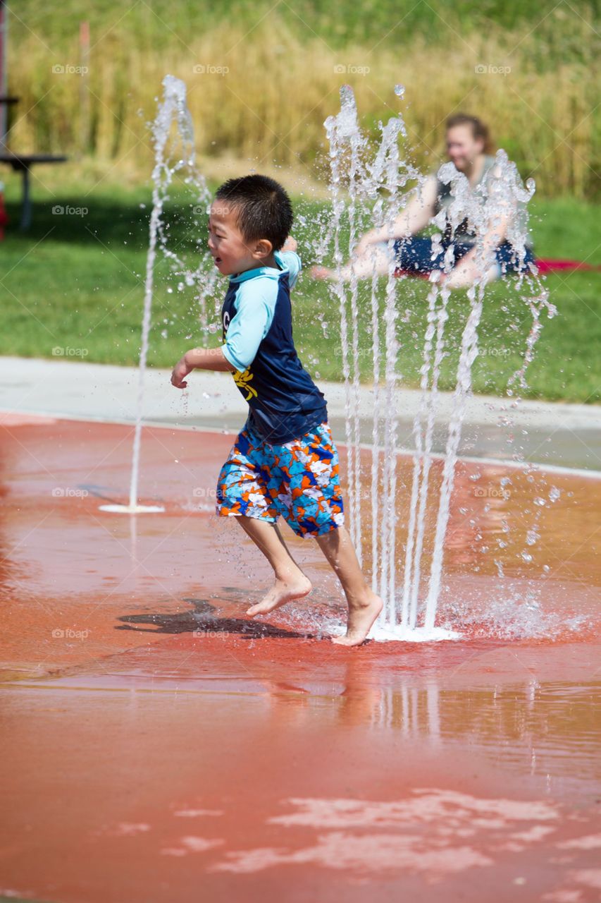 Boy playing water 