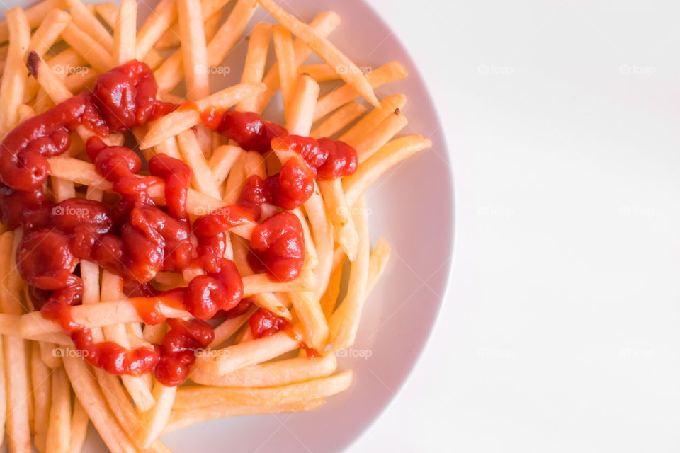 French Fries Potatoes With Red Sauce On Plate
