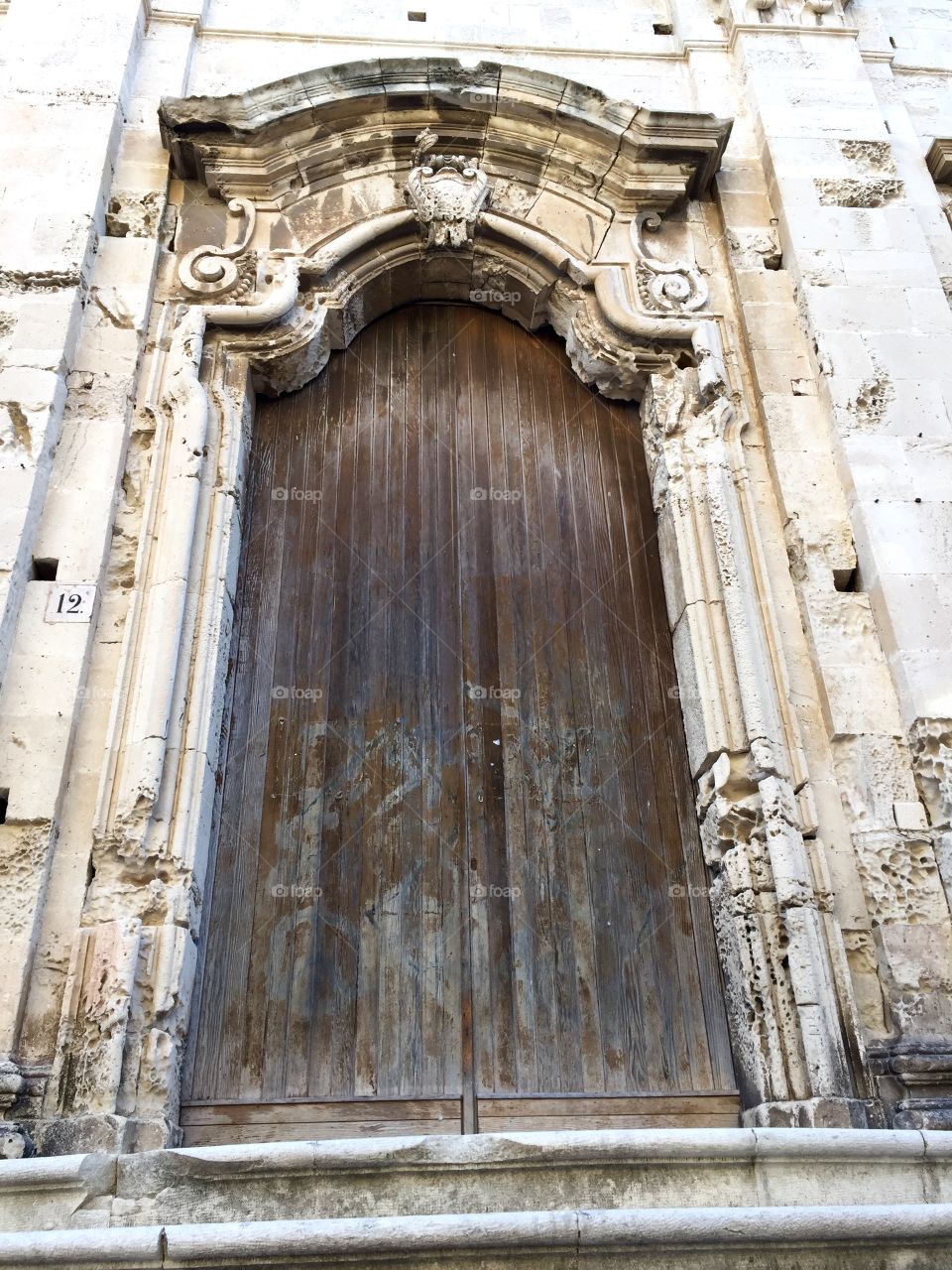 Low angle view of closed wooden door