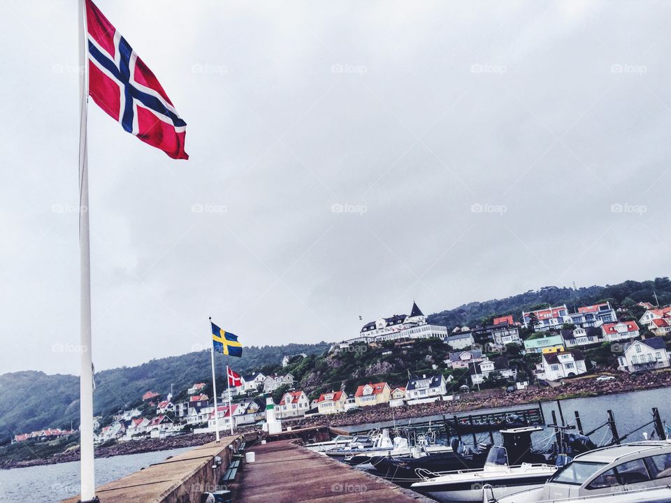 On the pier looking up to Grand Hotel in small little town called Mölle in the south west of Sweden .