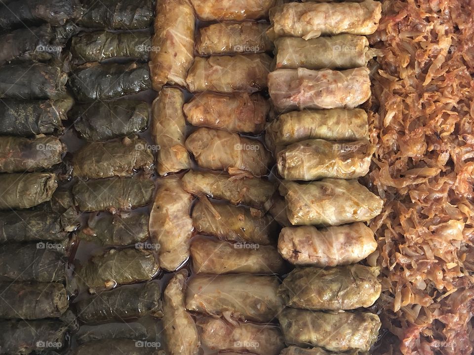 Stuffed Grape Leaves and cabbage leaves known as Sarmalute in foi de vita si foi de varza, romanian traditional food