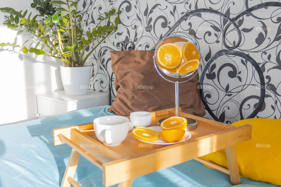 breakfast with vegetables and fruits and a reflection of oranges