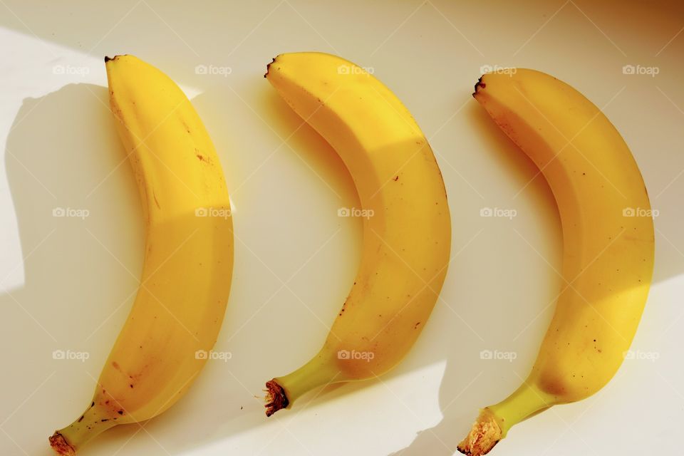 there bananas on a white background top view