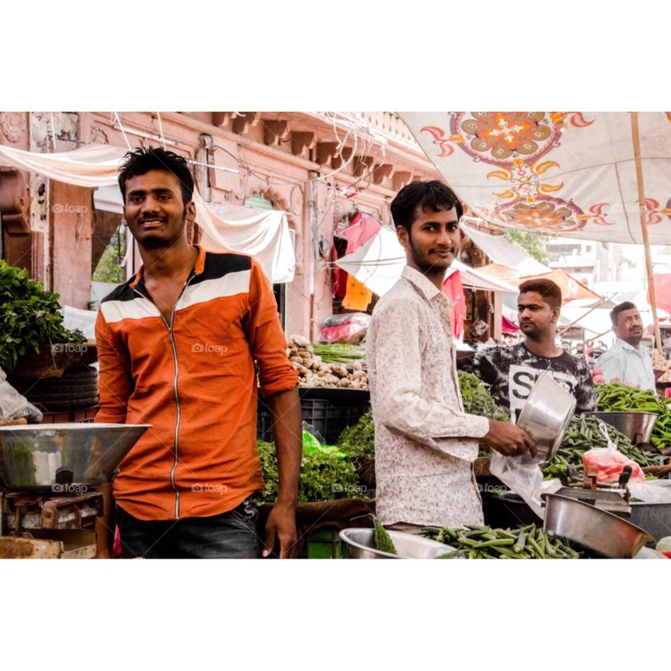 Boys in vegetable market