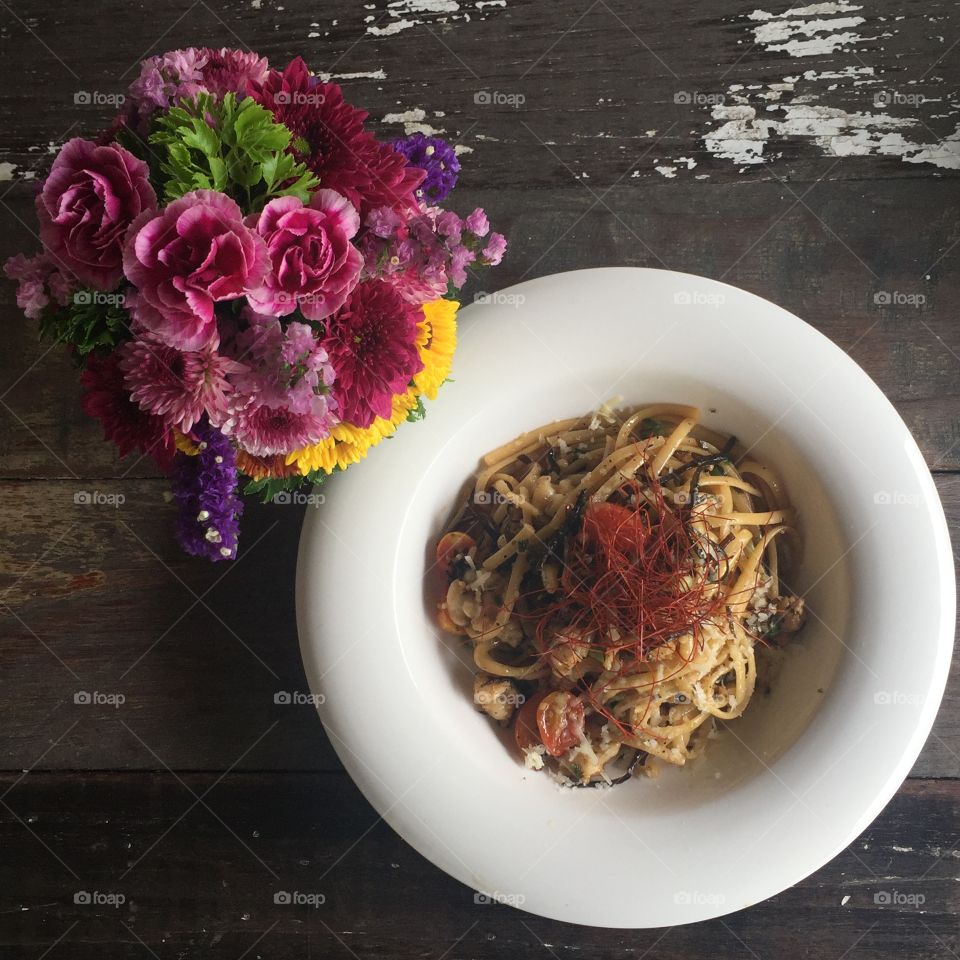 Rustic pasta with a pot of flowers