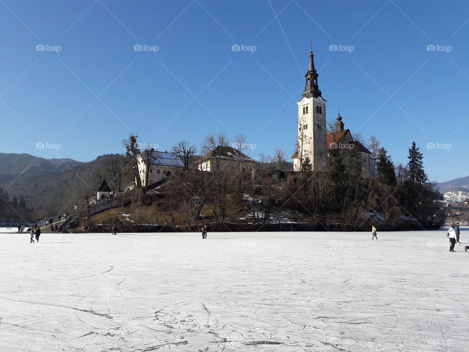church on an island on the frozen lake