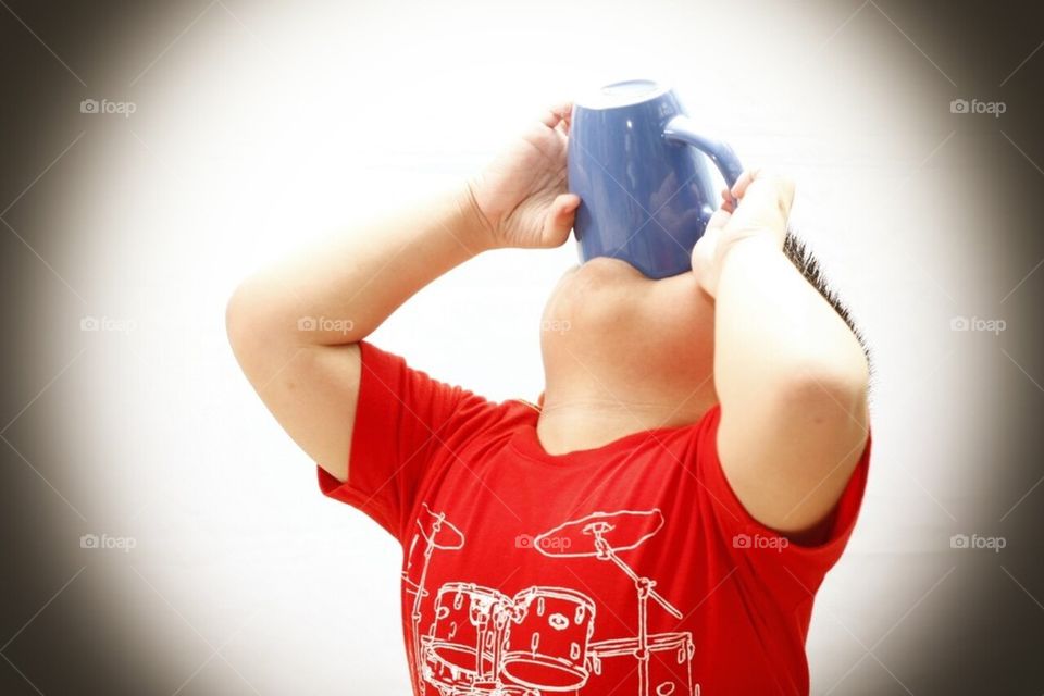 Child drinking from mug