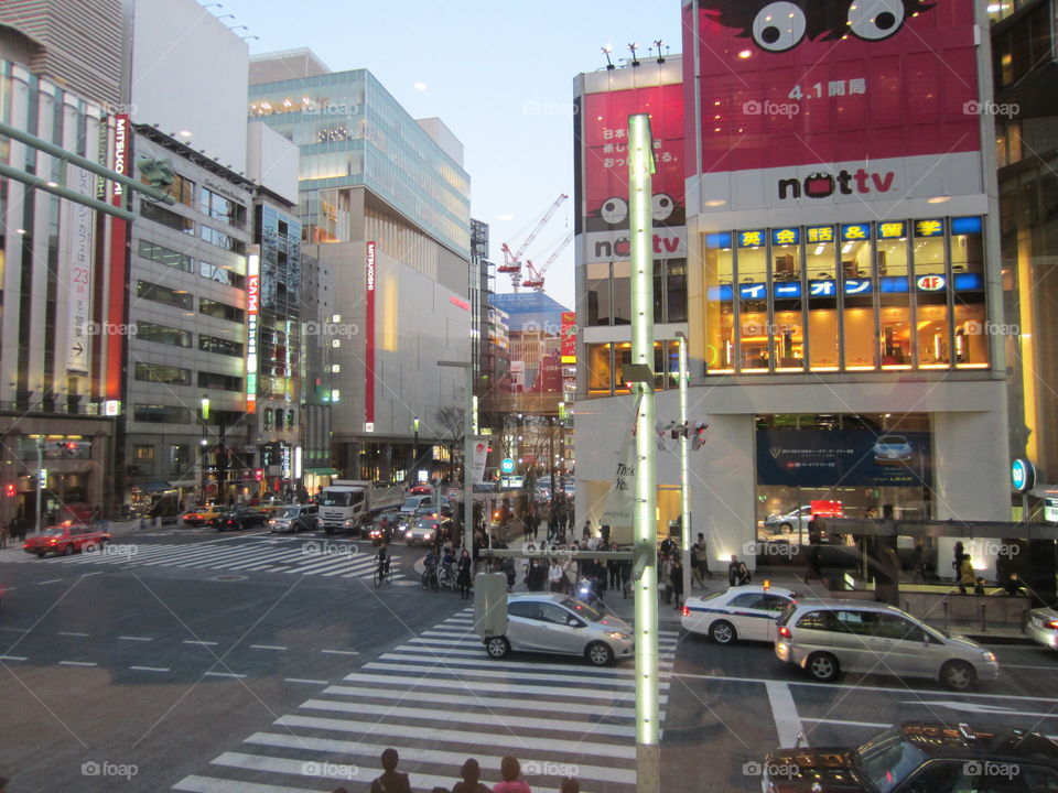 Ginza, Tokyo, Japan. Evening Street View of City Shopping District, Traffic and People