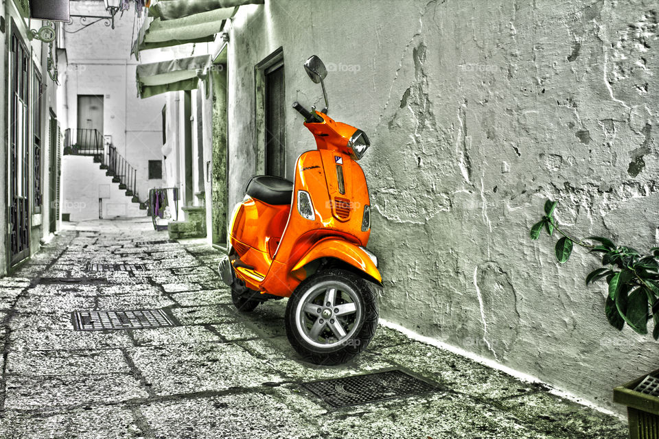 Scooter parked outside house