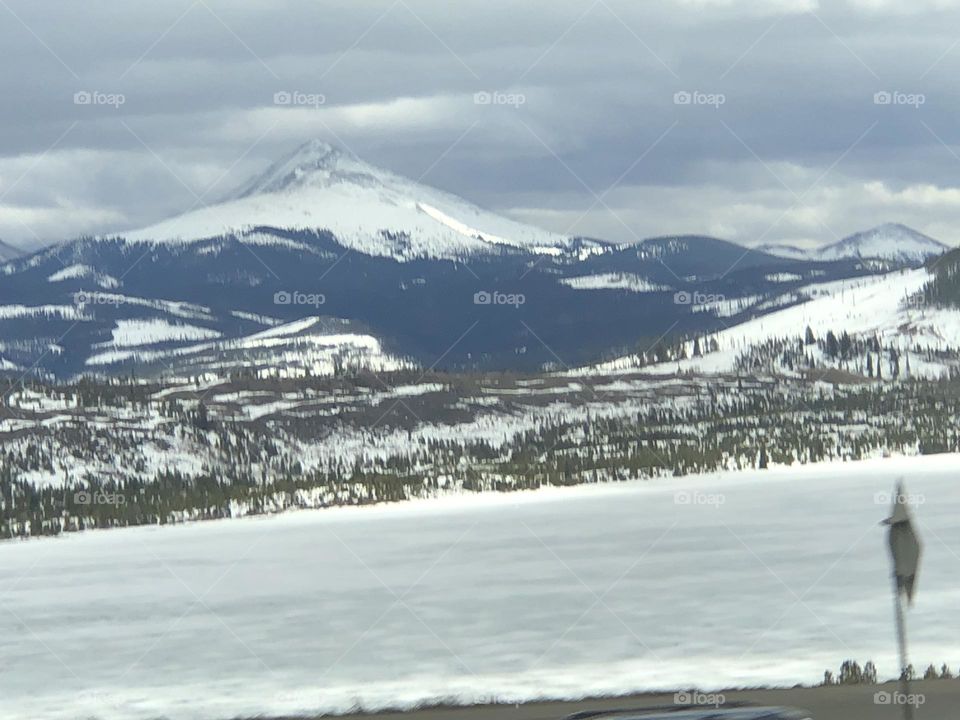 Snow covered mountains on a cloudy day