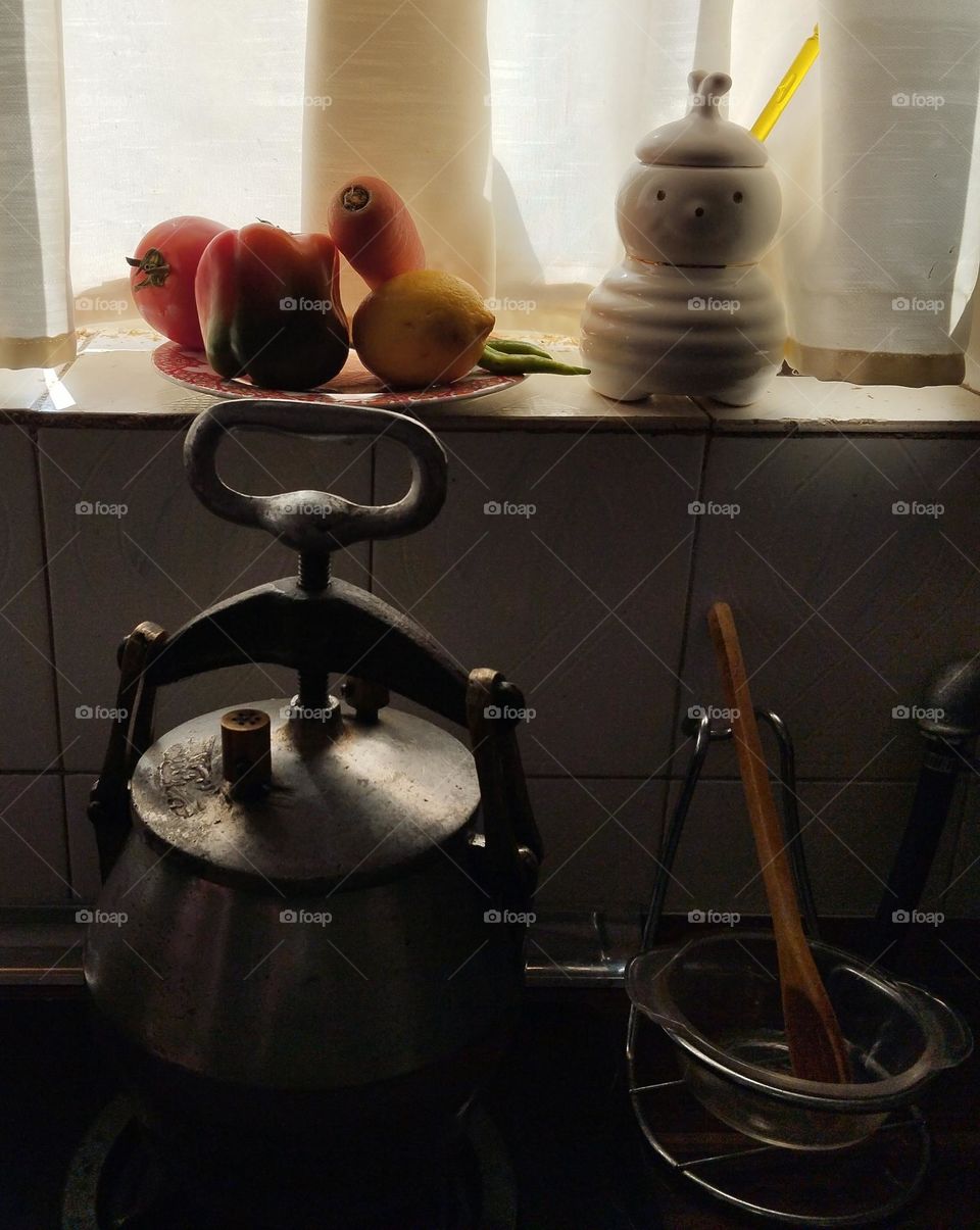 Old small PRESSURE COOKER is so helpful  when there is no time to cook slowly 
its age is about half a century.
 It increases the cooking speed and the vitamins of the food remain better. There is a safety valve on the lid of this device