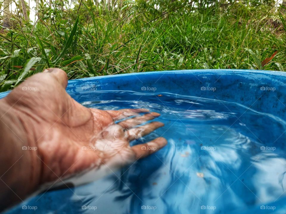 A bowl full of water on a rainy day