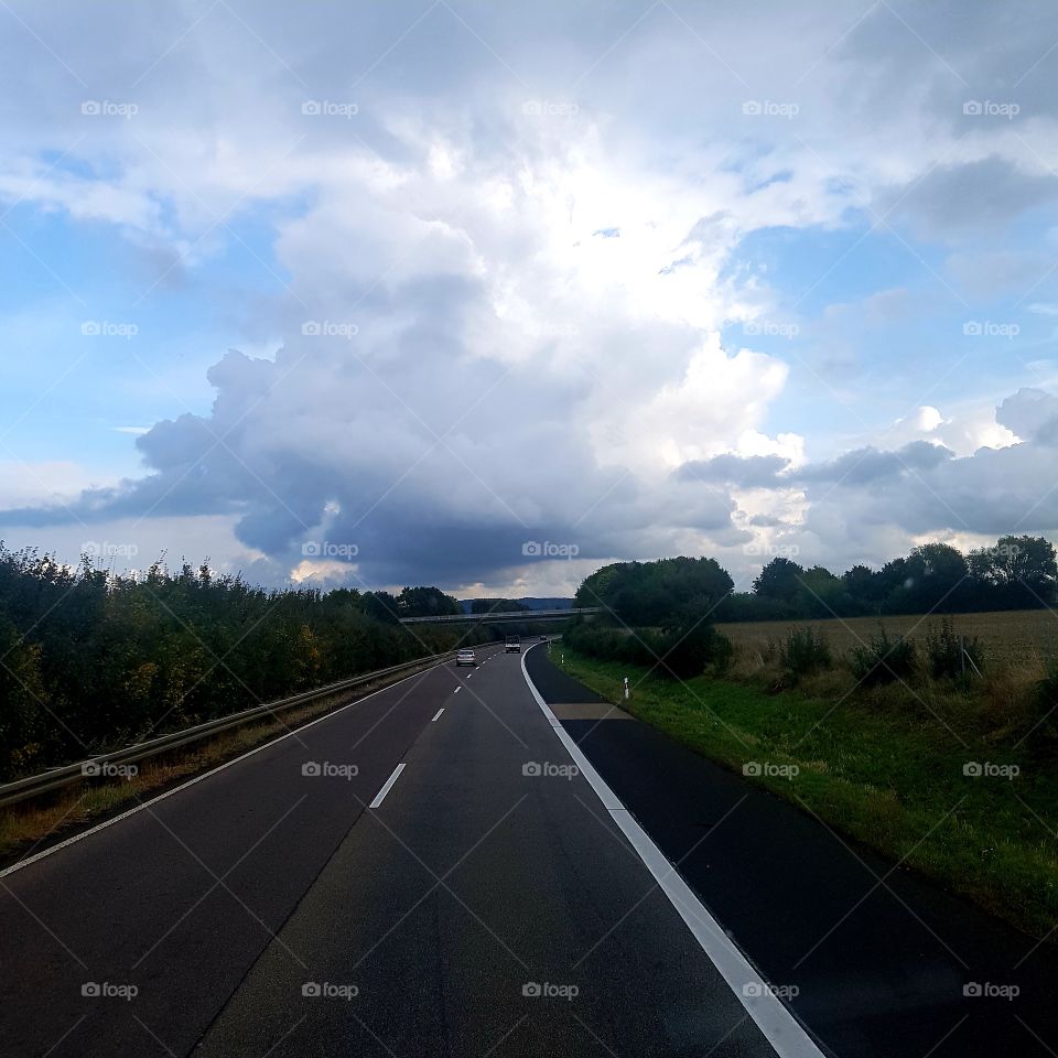 Road sky clouds