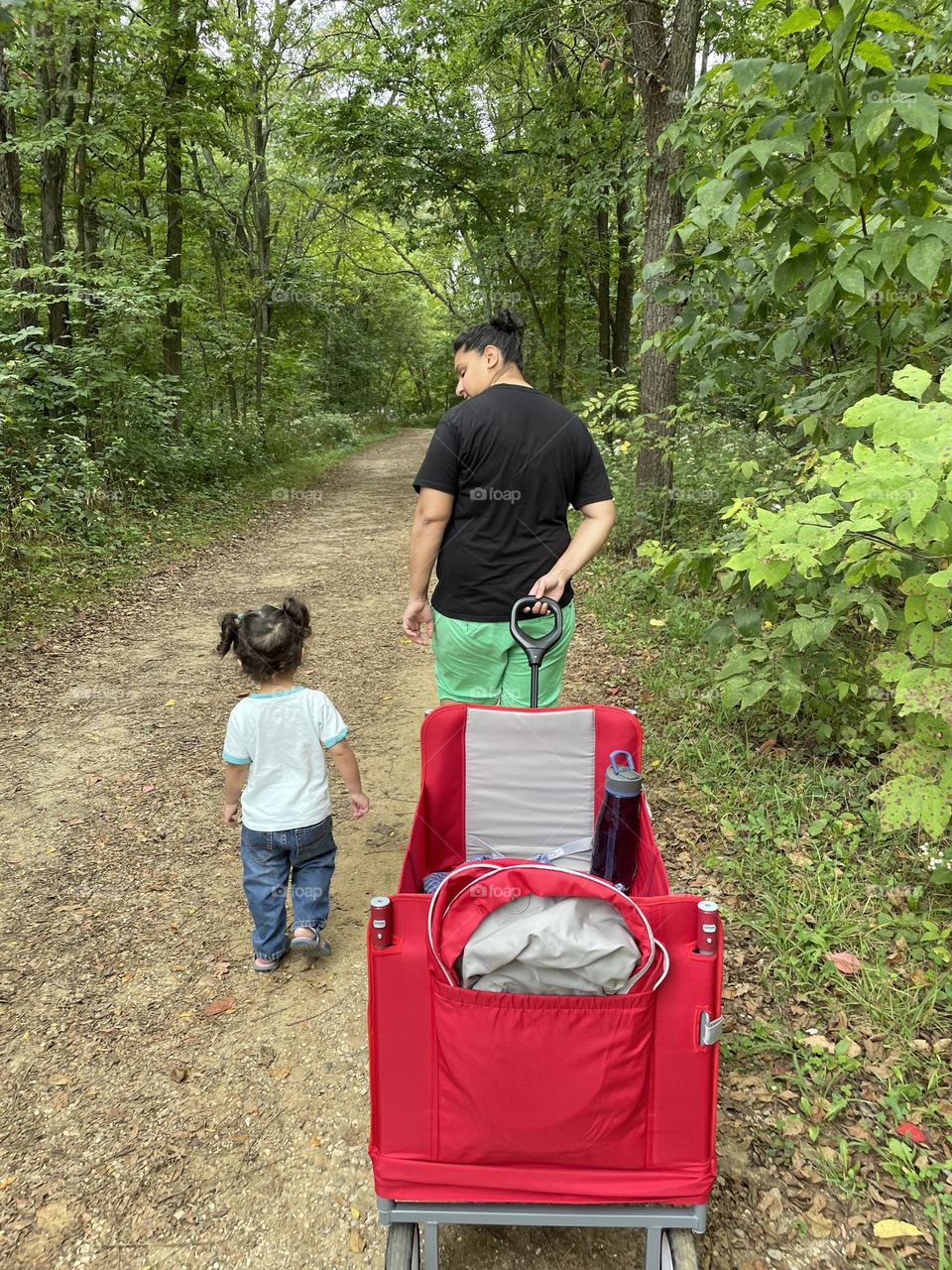 Toddler girl and mother walk in the forest, exploring nature with Mommy, loving mommy, tender moments in nature, spending time with family, family lifestyle 