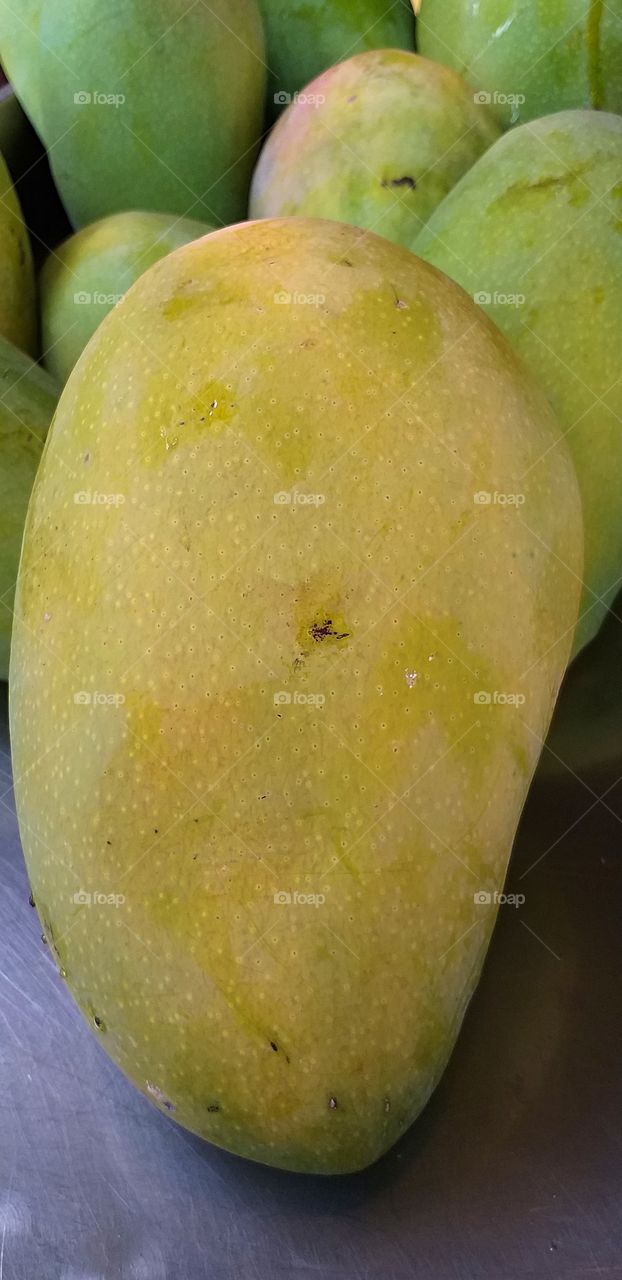 big mango. green mango.