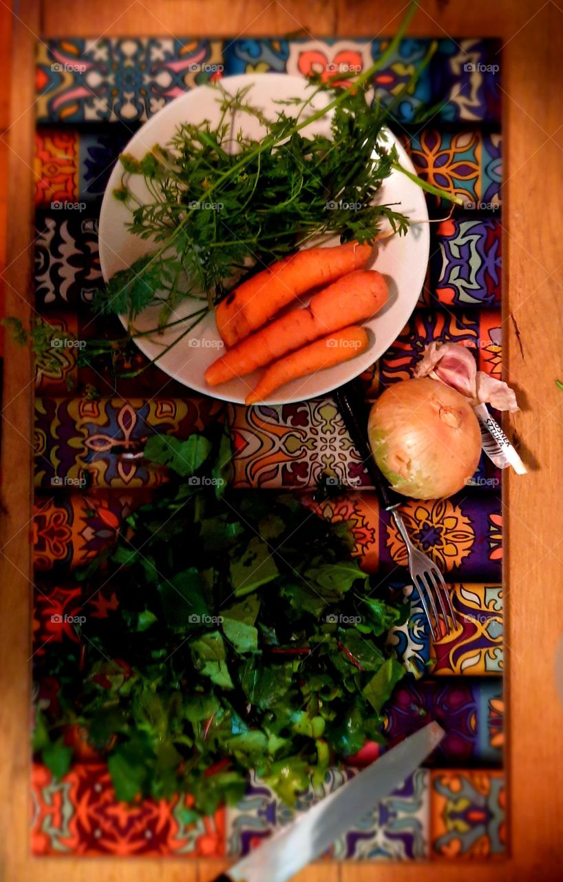 preparing salad with carrots on the plate