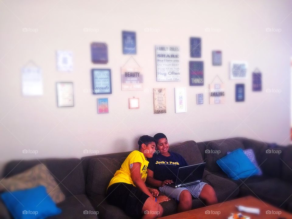 Teaching the boys how to work excel on the laptop.